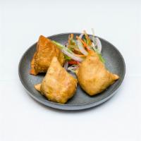 Samosa Vegetable (2) · Crisp turnover filled with mildly spiced potatoes and green peas. A vegetarian delight.