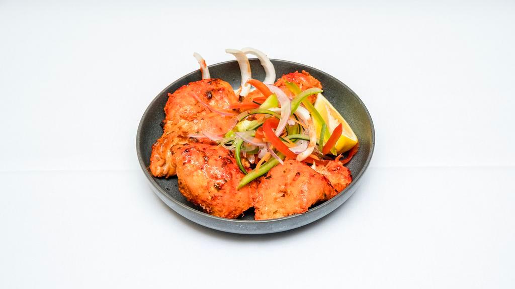 Chicken Tikka · Tender boneless pieces of chicken marinated with flavorful spices, then roasted over charcoal in the tandoor.