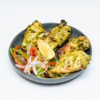 Chicken Hariyali Tikka · Boneless pieces of chicken marinated in mint and coriander flavored with ginger garlic. cook...