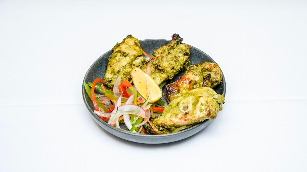 Chicken Hariyali Tikka · Boneless pieces of chicken marinated in mint and coriander flavored with ginger garlic. cooked in Tandoor