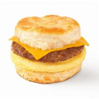Biscuit Breakfast Sandwich · Seasoned egg omelet, your choice of sausage patty or bacon, and sliced cheddar cheese on a w...