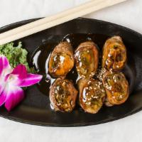 Beef Negimaki · Broiled beef rolled with scallion and teriyaki sauce.