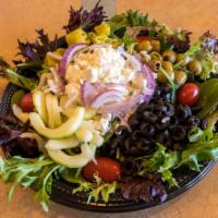 Greek Salad · Mixed greens, carrots, cucumber, tomato, peppers, olives, red onions, feta cheese, and roast...