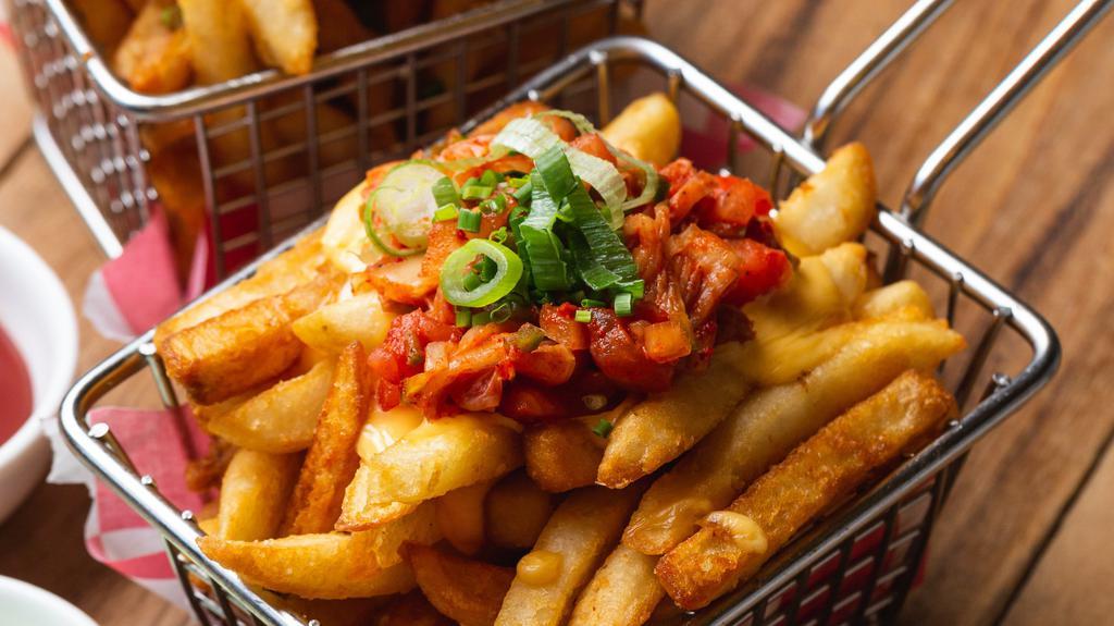 Kimchi Poutine · Vegetarian. French fries with carmelized kimchi, smothered in a cheese sauce.