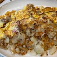 Flame Omelette · with Ham, Bacon, Sausage & Cheese.