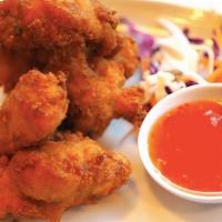 Thai-Style Chicken Wings · Most popular. Hot and spicy. Served with sweet chili sauce.
