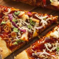 Bbq Chicken Pizza Slice · Topped with BBQ sauce, mozzarella, and chicken.
