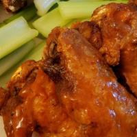 10 Pc. Buffalo Wings · Served with a dressing and celery sticks.