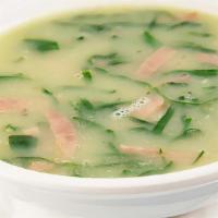 Caldo Verde · Brazilian green soup, with shredded collared green, potato pure and Portuguese sausage.