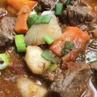 Carioca Picadinho · Beef stew, sirloin cubes with garlic, onions, sweet peppers and tomatoes, served with sweet ...