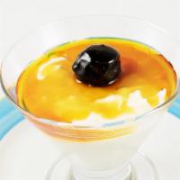 Creamy Coconut Pudding · Served with caramel and prunes.