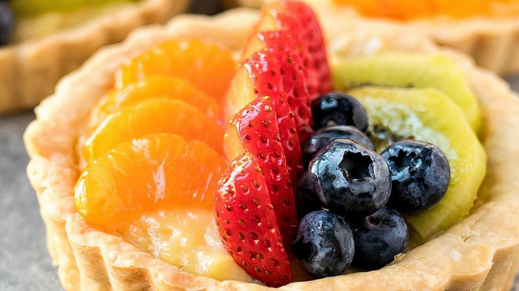 Fresh Fruit Tart With Vanilla Pastry Cream · This classic French fruit tart has a buttery shortbread crust, a creamy vanilla custard, and heaps of fresh fruit. This tart will win over all those who taste it..