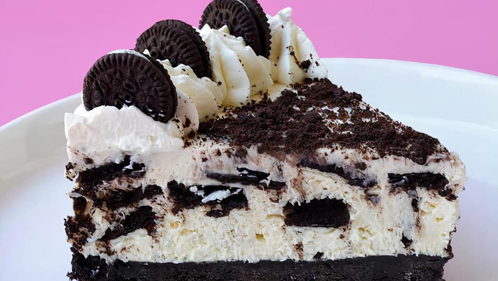 Fresh Oreo Mousse Cake Slice  · This Oreo cookie mousse cake starts with a fudgy brownie, Oreo cheesecake, chocolate chip cookie mousse and it's topped with whipped cream.