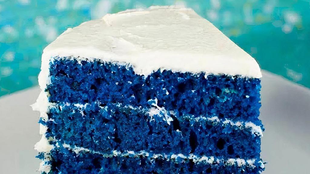 Blue Velvet Cake Slice · This fun twist on the classic red velvet cake takes on a new, blue hue in this royal blue velvet cake. By combining three tiers of fluffy royal blue cake and sweet marshmallow creme icing, this blue velvet cake recipe is impressive and delicious.