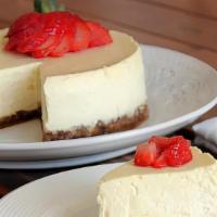Classic Ny Style Cheesecake Slice  · This dense, creamy New York Style Cheesecake is a slice of dessert heaven! It’s a rich, velv...