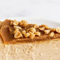 Ultimate Peanut Butter Cheesecake Slice  · Peanut Butter Cheesecake is a smooth and creamy cheesecake made with peanut butter and a hom...
