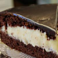 Boston Cream Chocolate Cake Slice · Boston cream cake is an American classic sure to win you over. It’s a decadent light, fluffy...