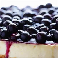 Fresh Blueberry Cheesecake Slice · This blueberry cheesecake starts with a buttery graham cracker crust, a creamy cheesecake ce...