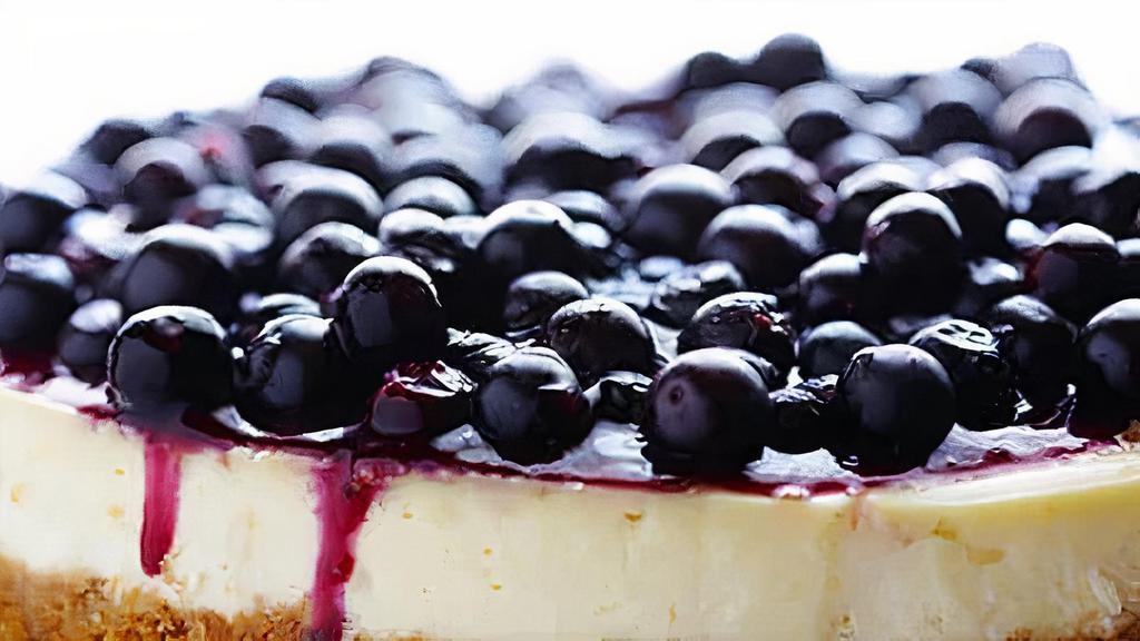 Fresh Blueberry Cheesecake Slice · This blueberry cheesecake starts with a buttery graham cracker crust, a creamy cheesecake center, and a tangy blueberry swirl.