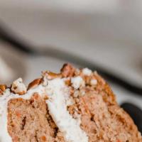 3' Love Carrot Cake · This dense classic cake is packed with fresh carrots, raisins, nuts and sweetened with fruit...