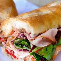 Freshly Made Godfather Sandwich · Italian salami, Italian mortadella, soppressata, coppa, baby arugula, provolone cheese, roas...