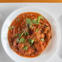 Goat Vindaloo · Spicy. A spicy Goan dish marinated with vinegar and spices, simmered in onion & tomato gravy.