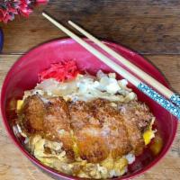 Katsudon · Crispy pork or chicken cutlet sliced, organic egg, onions, dashi, over Japanese rice.