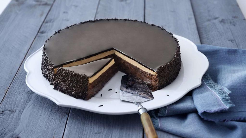 From Ecuador, With Love · Four perfect layers of chocolate cake made with cocoa from Ecuador, filled with chocolate and hazelnut creams and crunch, covered with a chocolate glaze.
