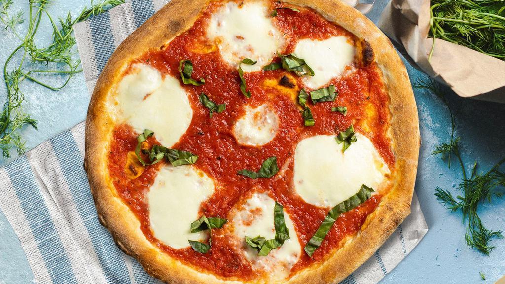Margherita Aura Pizza · Italian tomato, basil, and fresh mozzarella baked on a hand-tossed dough.