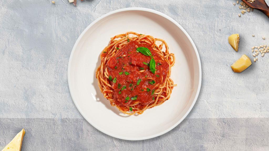 Spaghetti Prime Pomodoro · Fresh spaghetti cooked with classic Italian tomato sauce and fresh basil.