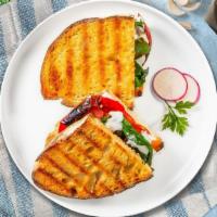 The Bertolucci Panini · Fresh mozzarella, tomato, and basil on freshly baked bread. Served with a salad.