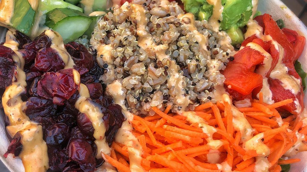 Grain Bowl · Quinoa/Farro + kale + baby greens + avocado + red peppers + cucumbers + dried cranberries + carrots