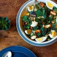 Kale & Mint Salad · A refreshing Shredded de-stemmed Kale and Fresh Mint salad topped with Fried Egg, Croutons, ...