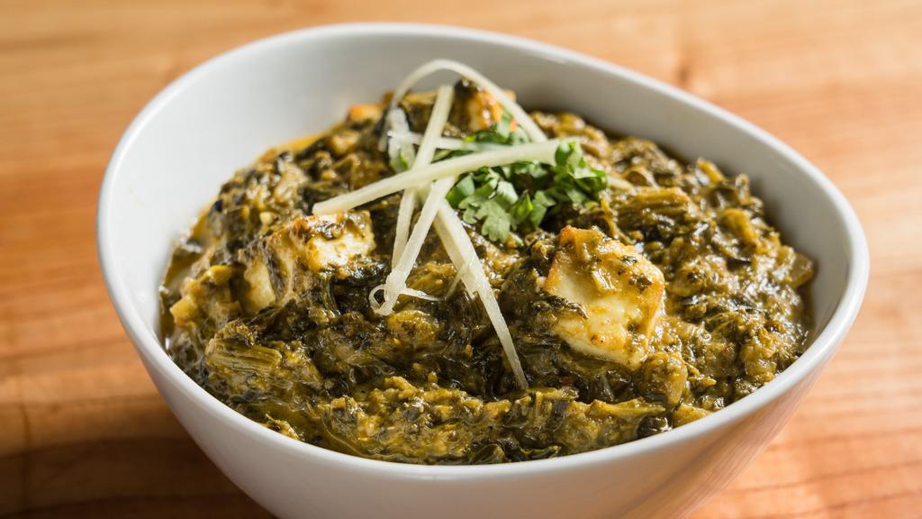 Saag Paneer · Cottage cheese cooked with fresh spinach and grounded spices.