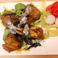 Lamb Chops Masaledar · Grilled lamb chops cooked with onions, tomatoes and with hot spices.