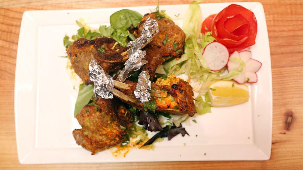 Lamb Chops Masaledar · Grilled lamb chops cooked with onions, tomatoes and with hot spices.