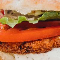 Crispy Chicken · Delicious vegan ranch, tomatoes, and lettuce with a crispy plant based chicken patty served ...