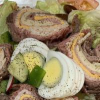 Chef'S Salad · Mixed salad greens American and swiss cheese, ham, turkey, roast beef, hard boiled eggs, tom...