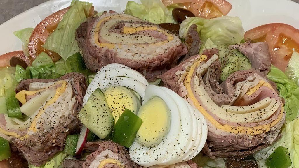 Chef'S Salad · Mixed salad greens American and swiss cheese, ham, turkey, roast beef, hard boiled eggs, tomatoes and cucumbers.