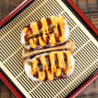 Onigirazu · Two pieces. Sushi sandwich. Choice of chicken adobo or shrimp tempura sandwich between rice,...