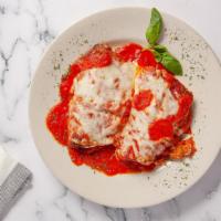 Eggplant Rollatini · Slices of eggplant, lightly breaded and covered with ricotta and other cheeses and seasonings.