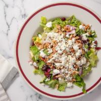 Kim'S Salad · Baby spinach topped with crumbled gorgonzola cheese, walnuts and cranberries. comes with a s...