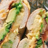 South Of The Border · Two scrambled eggs, black bean spread, cheddar cheese, salsa, and 1/4 avocado.