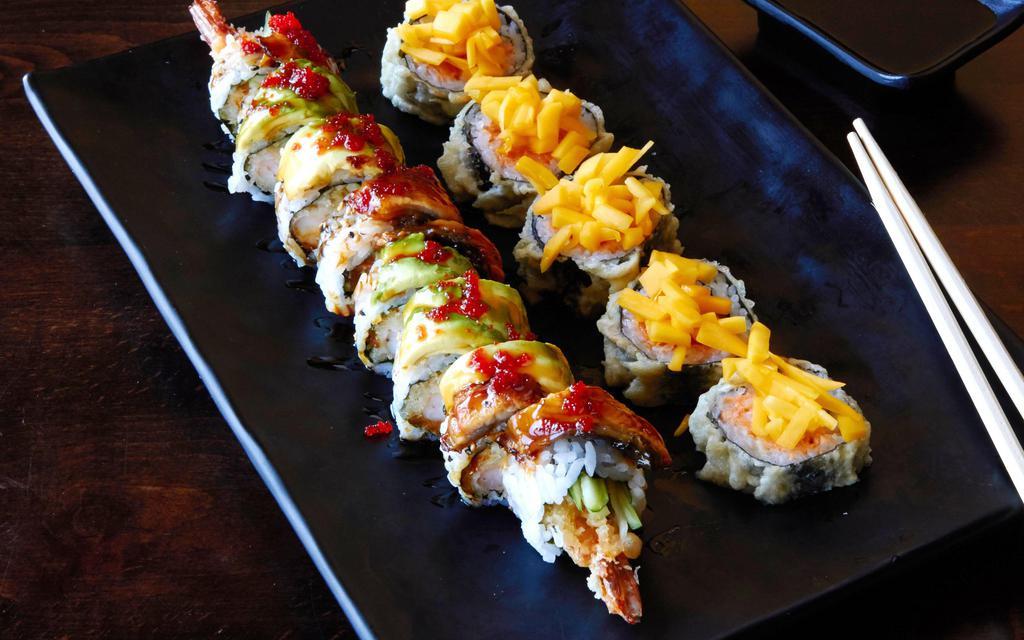 Golden Mango Roll · Fried spicy salmon roll with mango on top.