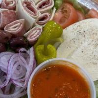Antipasti Salad · Iceberg Lettuce, Ham/Provolone roll ups, Roasted Peppers, Red Onions, Black Olives, Pepperon...