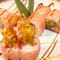 Paradise Roll · Spicy lobster, shrimp tempura and fried banana, wrapped with soy paper, mango sauce.
