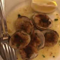 Clams Oreganata · Little neck clams, seasoned breadcrumbs, lemon, and EVOO.