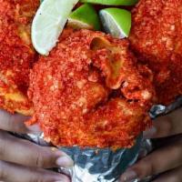 Hot Cheetos Burrito · 13 INCH FLOUR LAYERED WITH: SHREDDED CHEESE, (CHOICE OF PROTEIN), GUACAMOLE, ONION, CILANTRO...