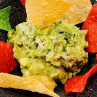Chips & Guacamole · Crispy corn tortilla chips with authentic guacamole. A blend of gently mash avocado with jal...