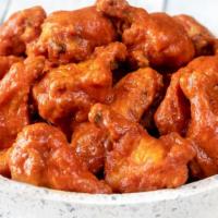 Mild Wings · 8 juicy deep-fried chicken wings tossed in our mild sauce. Comes with a bleu cheese sauce an...